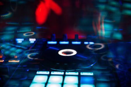 DJ mixer controller for mixing music in a nightclub