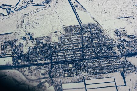 aerial photography from the height of the city plane in the snow in Siberiaの写真素材