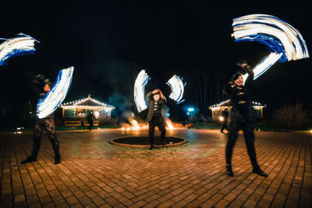 SEMIGORYE, IVANOVO OBLAST, RUSSIA - APRIL 28, 2017: Fire show with burning sparkling torches from professional artistsのeditorial素材