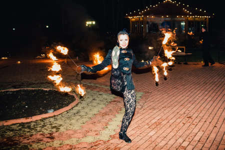 SEMIGORYE, IVANOVO OBLAST, RUSSIA - APRIL 28, 2017: Fire show with burning sparkling torches from professional artistsのeditorial素材