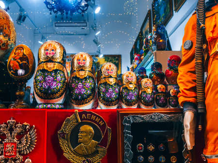MOSCOW, RUSSIA - JANUARY 31, 2020: Matryoshka dolls and other traditional Russian Souvenirs and symbols of the Soviet era on a shop windowのeditorial素材