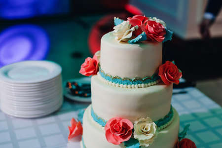wedding cake in white and blue glazeの写真素材
