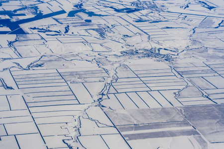 aerial photography of roads and fields in snow in Russia