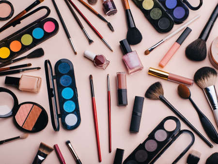 set of female cosmetics for eye makeup, skin face care. Professional products for beauty on a pink backgroundの写真素材