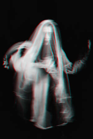 portrait of a Ghost girl in a dress with blurred on a dark background