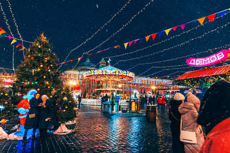 MOSCOW, RUSSIA - JANUARY 31, 2020: Decorated with Christmas decor red square in Moscow with a fair with people at night in winterのeditorial素材