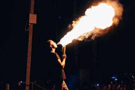 VICHUGA, RUSSIA - JUNE 17, 2018: Fire show, fakir man makes the night presentation