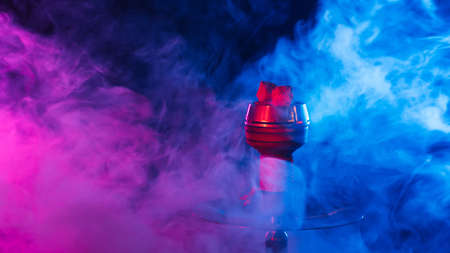 Hookahs with glass flasks and metal bowls on the tableの写真素材