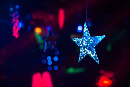 Christmas decor of stars on a colorful backgroundの写真素材