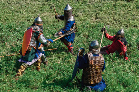 LUH, RUSSIA - AUGUST 27, 2016: Reconstruction of medieval battle of knights in armor and weapons at...