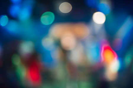 multicolored bokeh from bright colored spotlights in a nightclub