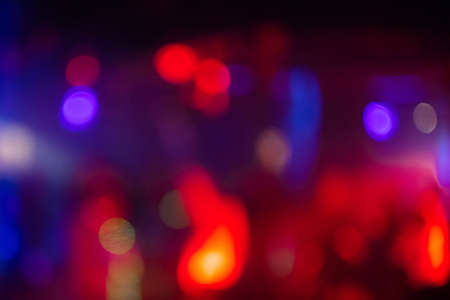 multicolored blurred background with bright red bokeh