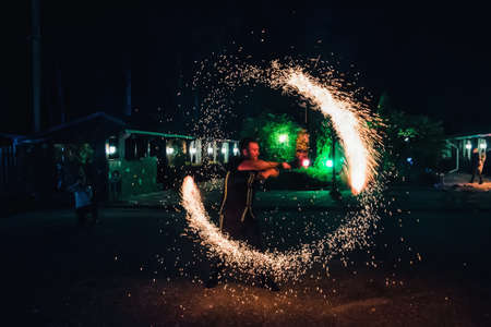 IVANOVO, RUSSIA - AUGUST 23, 2016: Professional performers dancers with fiery sparkling torches performed a fire showのeditorial素材