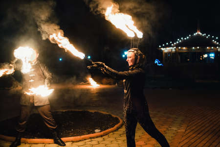SEMIGORYE, IVANOVO OBLAST, RUSSIA - APRIL 28, 2017: Fire show with burning sparkling torches from professional artistsのeditorial素材