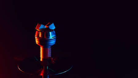 hot red coals for hookah shisha in a metal bowl on a black background