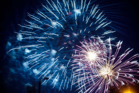 Colorful fireworks on background night sky. The explosions of the salute at festivalの写真素材
