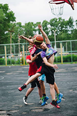 VICHUGA, RUSSIA - JUNE 11, 2016: Teenagers playing streetball on the celebration of the city of Vichugaのeditorial素材