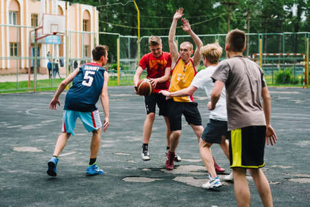 VICHUGA, RUSSIA - JUNE 11, 2016: Teenagers playing streetball on the celebration of the city of Vichugaのeditorial素材
