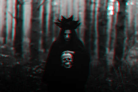 dark portrait of a witch girl in a black costume