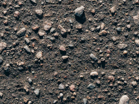 texture of dirty old asphalt with stonesの写真素材
