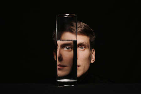 portrait of a man through the glass of a waterの写真素材