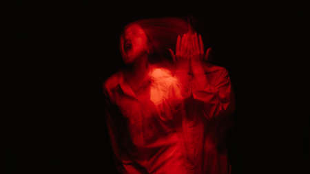 portrait of a psychotic woman with schizophrenic diseases and mental disordersの写真素材