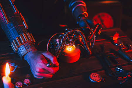 Steampunk cosplay. Hands of a man an engineer inventor repairing a fantastic post-apocalypse glassesの写真素材