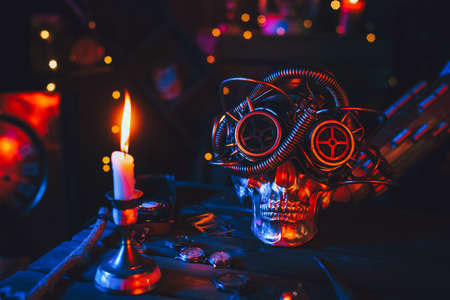 Cyberpunk atmosphere. Skull in steampunk glasses on a table