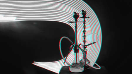 two hookahs with shisha coals pink neon lighting
