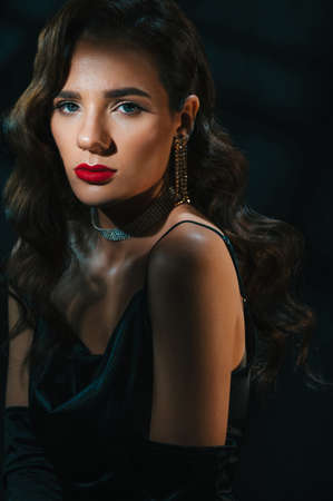 Portrait of a woman in the style of a classic retro Hollywood movie of the 1950s. Elegant young girl...