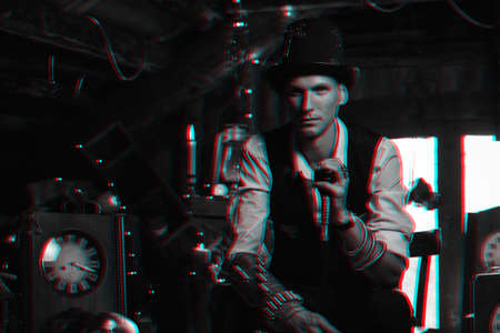 man in a hat and with a cane cosplays a character of a steampunk computer game. Inventors cyberpunk concept with 3d glitch effect of virtual realityの写真素材