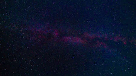 Starry Milky Way at night with stars on background of a dark blue night skyの写真素材