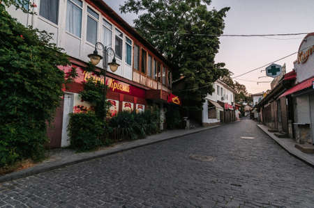 GURZUF, RUSSIA - SEPTEMBER 1, 2021: beautiful ancient cobblestone street with historical buildings in resort of Gurzufのeditorial素材