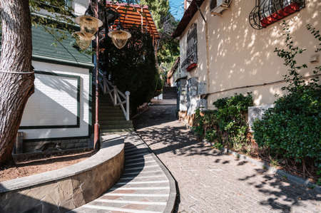 GURZUF, RUSSIA - AUGUST 31, 2021: beautiful narrow picturesque lane in resort of Gurzuf on the Black Sea in Russiaのeditorial素材