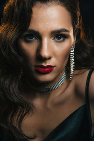 stylish woman in the classic retro style of 1950s movies with a beautiful hairstyle and makeupの写真素材