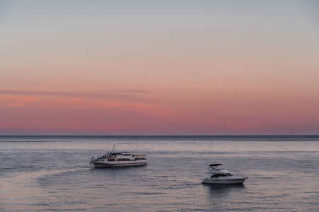 white motor yacht and cruise liner at sea on summerの写真素材