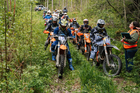 REPUBLIC OF KARELIA, RUSSIA - CIRCA JUNE, 2022: Off-road tournament Ladoga Trophy 2022 in Karelia. Motorcycle racers on sport off-road motorcyclesのeditorial素材