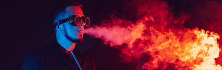 man in futuristic glasses smokes a hookah and blows a cloud of smoke in a shisha barの写真素材