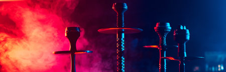 hookahs with shisha bowls and coals on the table in the interior of the lounge cafeの写真素材