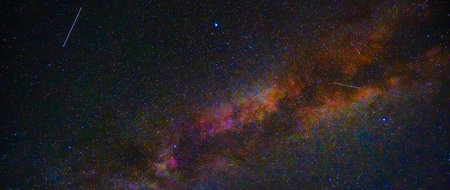 starry night sky with Milky way and shooting stars, meteorites and cometsの写真素材