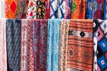 Traditional Indian scarves with colorful pattern at an Asian bazaar in India close-upの写真素材