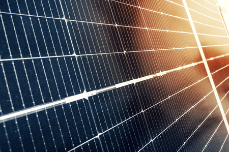cells of modern blue solar panel in sun close-up. Green renewable energy