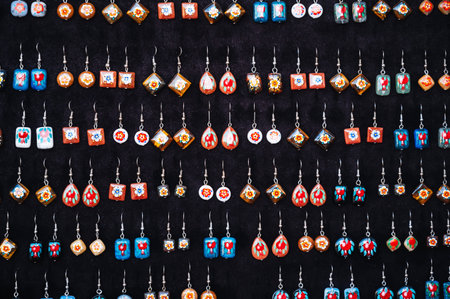 handmade oriental Uzbek earrings with hand-painted traditional patterns of stonesの写真素材