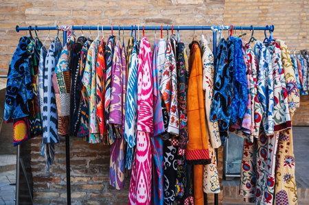 colorful traditional Uzbek dresses at oriental street bazaar in Uzbekistan