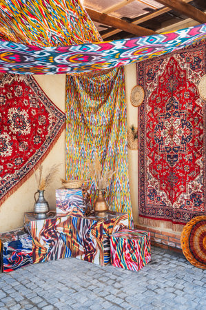 Beautiful expensive vintage traditional red handmade carpets at the oriental bazaar in Uzbekistanの写真素材