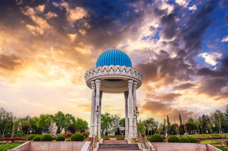monument Patriots Memorial white rotunda with a blue dome in park in spring in Tashkent in Uzbekistanの写真素材