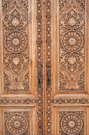 carved wooden door with oriental pattern Uzbek ornament in Museum of Victims of Political Repression in Tashkent close-upの写真素材