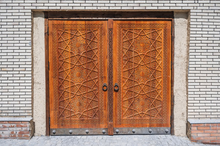 modern carved wooden gate with Islamic Uzbek carved pattern with stars ornament in oriental style in Uzbekistanの写真素材