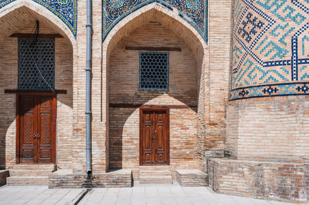 Uzbek carved wooden doors to Kukeldash Madrasah with pattern decorated with oriental arabic carved...