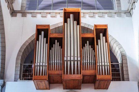pipes of a church organ inside the interior of a Christian Catholic church. Cathedral of Sacred Heart of Jesus in Tashkent in Uzbekistanの写真素材